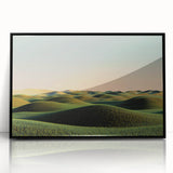 Framed acrylic landscape artwork showcasing a serene countryside scene, featuring vibrant green fields and a clear blue sky, elegantly displayed with a sleek black frame.