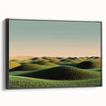 Framed canvas artwork depicting a serene countryside landscape with lush green fields and a clear blue sky, enhanced by a sleek black frame, perfect for home decor.