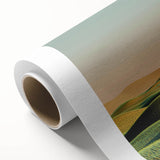 Rolled canvas artwork depicting serene countryside landscapes, showcasing lush green fields and a clear blue sky, ideal for home decor. Packaged securely in a protective cardboard tube.