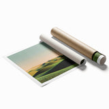 Rolled print showcasing a vibrant countryside landscape with lush green fields and a serene sky, elegantly packaged in a protective cardboard tube for safe delivery.