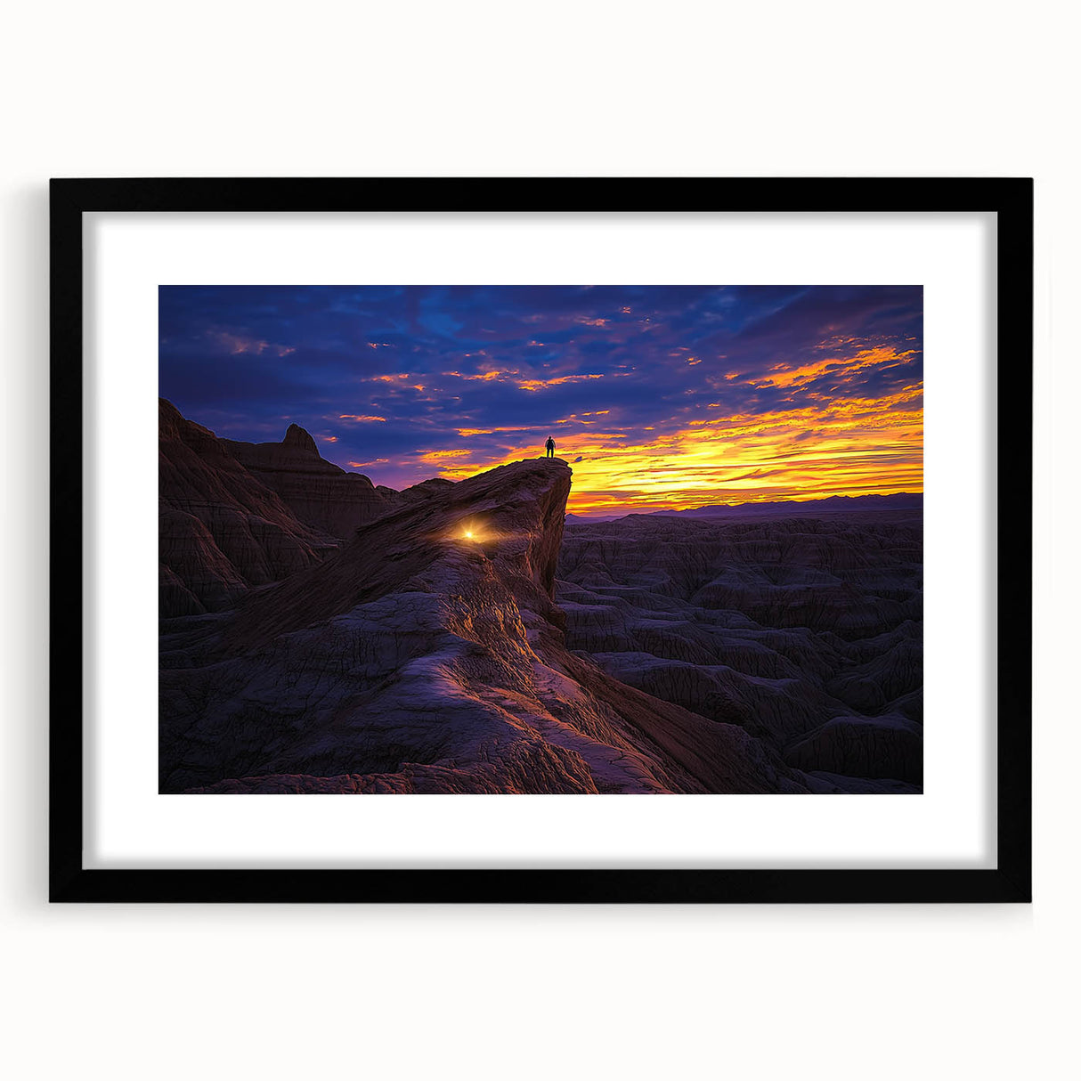 Framed desert landscape artwork featuring vibrant colors and intricate details, showcased in a sleek black frame with a mat, ideal for home decor.