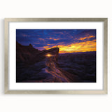 Desert landscape artwork framed in a silver mat, showcasing vibrant colors and intricate details, perfect for modern home decor or office settings.