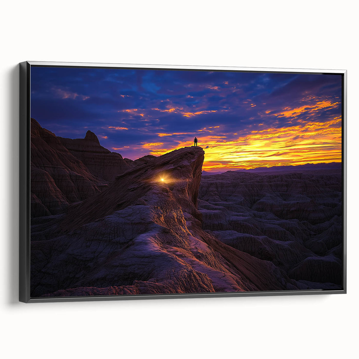 Framed canvas artwork showcasing a vibrant desert landscape with rich warm tones, displayed in a sleek black frame, perfect for modern home decor.