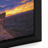 Close-up of a framed canvas artwork showcasing a vibrant desert landscape with warm tones, intricate details, and a textured finish, ideal for enhancing home decor.