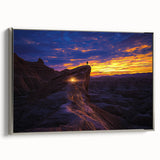 Framed canvas artwork depicting a stunning desert landscape with vibrant colors, featuring a silver frame that enhances the visual appeal, perfect for home decor.