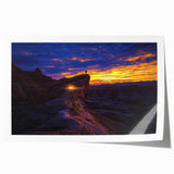 Desert landscape canvas print featuring vibrant hues of orange and yellow, showcasing rolling dunes under a clear blue sky, rolled and ready for display.