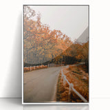 Art deco poster depicting a stylized fall scene in orange and brown tones, framed in white acrylic.