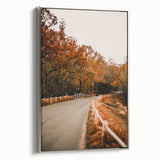 Framed canvas featuring a landscape art painting of a fall scene with colorful foliage, on a silver frame.