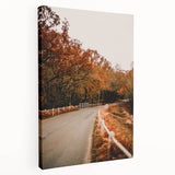 Side view of a stretched canvas featuring an autumn-themed landscape with warm orange and brown tones.