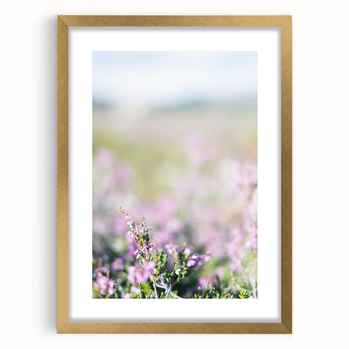 Extra large abstract art print depicting textured spring motifs in pastel shades, framed in gold.