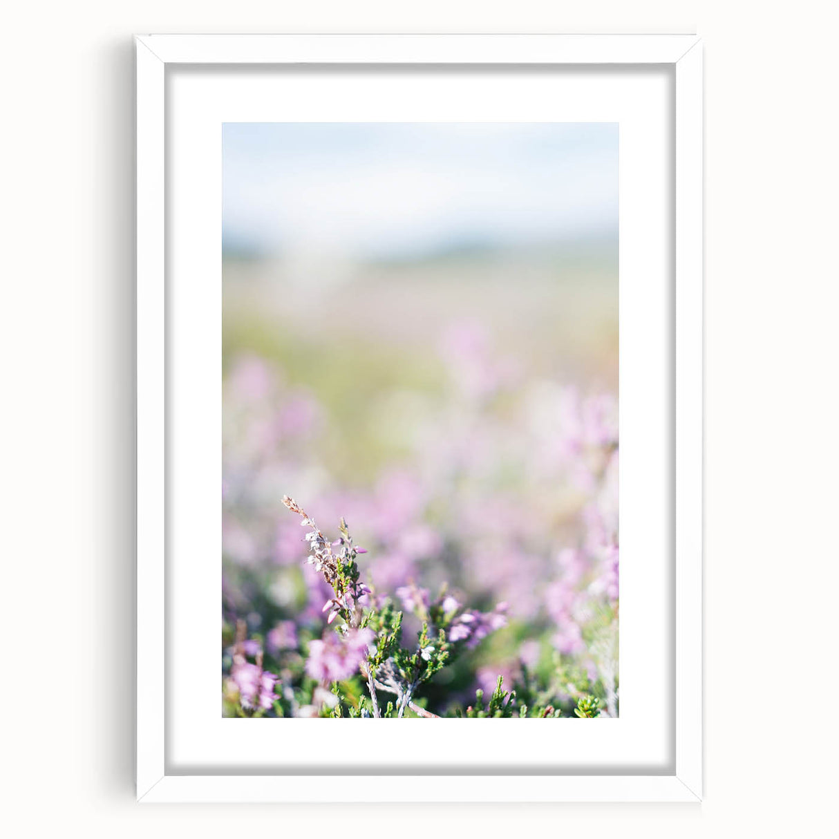 Abstract art print featuring swirling pastel hues on a white framed canvas, suitable for bedroom or dining room decor.