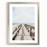 Textured abstract art print in silver frame, featuring soft gray and white swirls, ideal for bedroom wall decor.