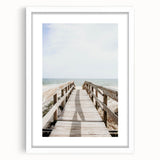 Abstract art print with swirling blues and greens on a white framed canvas, suitable for dining room or bedroom decor.