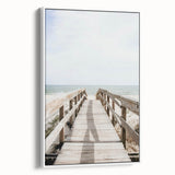 Vintage poster art on a large framed canvas, featuring colorful abstract designs on a black background.