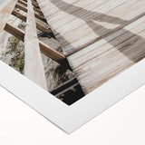 Art deco poster featuring geometric patterns in muted gold and black on a rolled canvas, suitable for dining room walls.