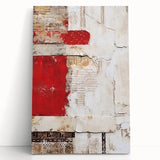 Abstract canvas wall art showcasing vibrant strokes in shades of blue, orange, and yellow, elegantly leaning against a neutral wall, enhancing modern decor.