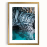 Elegant gold-framed landscape artwork depicting a serene cave scene, featuring rich colors and a textured mat, ideal for home decor and art enthusiasts.