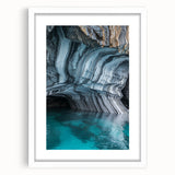 White-framed landscape artwork depicting a serene cave scene, beautifully matted for an elegant presentation, ideal for home decor or gallery display.