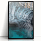 Framed acrylic artwork showcasing a stunning landscape with intricate cave formations, featuring a sleek black frame that enhances its modern aesthetic.
