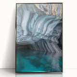 Framed acrylic artwork depicting a serene landscape with caves, featuring silver accents and a modern aesthetic, ideal for contemporary home decor.