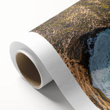 Vibrant rolled canvas depicting a stunning landscape of cliffs under a bright blue sky, showcasing rich colors and intricate details, ideal for home decor.