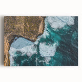 Stretched canvas artwork showcasing a vibrant landscape with dramatic cliffs under a clear blue sky, perfect for home decor or office ambiance.