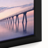 Close-up of a framed landscape canvas print showcasing a serene bridge scene with lush greenery and a tranquil river, perfect for home decor.