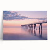 Stretched canvas artwork depicting a scenic landscape bridge surrounded by lush greenery, ideal for home decor, evoking tranquility and nature's beauty.