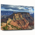 Acrylic glass landscape artwork of canyons displayed from a side view, showcasing vibrant colors and intricate details, secured with decorative pins for modern decor.