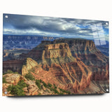 Acrylic glass landscape artwork of canyons displayed from a side view, showcasing vibrant colors and intricate details, secured with decorative pins for modern decor.