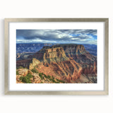 Silver-framed landscape art print showcasing a stunning canyon scene, featuring vibrant colors and intricate details, accented with a white mat for an elegant presentation. Perfect for home decor enthusiasts seeking nature-inspired artwork.