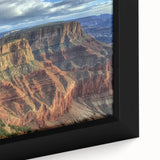 Framed canvas artwork showcasing a vibrant landscape of canyons, featuring rich earthy tones and intricate textures, ideal for enhancing modern home decor.