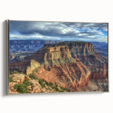 Framed canvas artwork depicting a stunning landscape of canyons in warm tones, featuring a sleek silver frame that enhances the artwork’s beauty and depth. Perfect for adding a touch of nature-inspired elegance to any home decor.