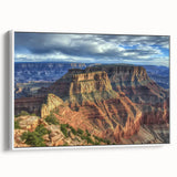 Framed canvas artwork depicting a vibrant landscape of canyons in rich earth tones, showcased from a side view against a white background, ideal for home decor.