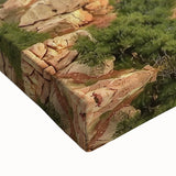 Close-up view of a stretched canvas showcasing a vibrant landscape of canyons with rich colors and intricate details, ideal for home decor or art enthusiasts.