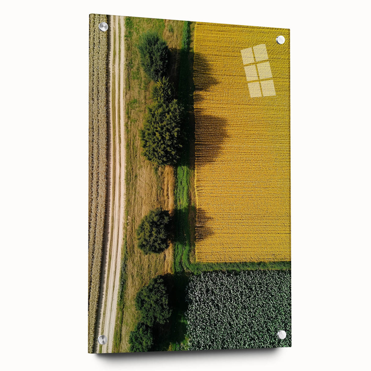 Acrylic glass artwork depicting a serene countryside landscape, showcasing vibrant green fields and rolling hills, mounted with pins for display. Perfect for home decor.