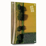 Acrylic glass artwork depicting a serene countryside landscape, showcasing vibrant green fields and rolling hills, mounted with pins for display. Perfect for home decor.