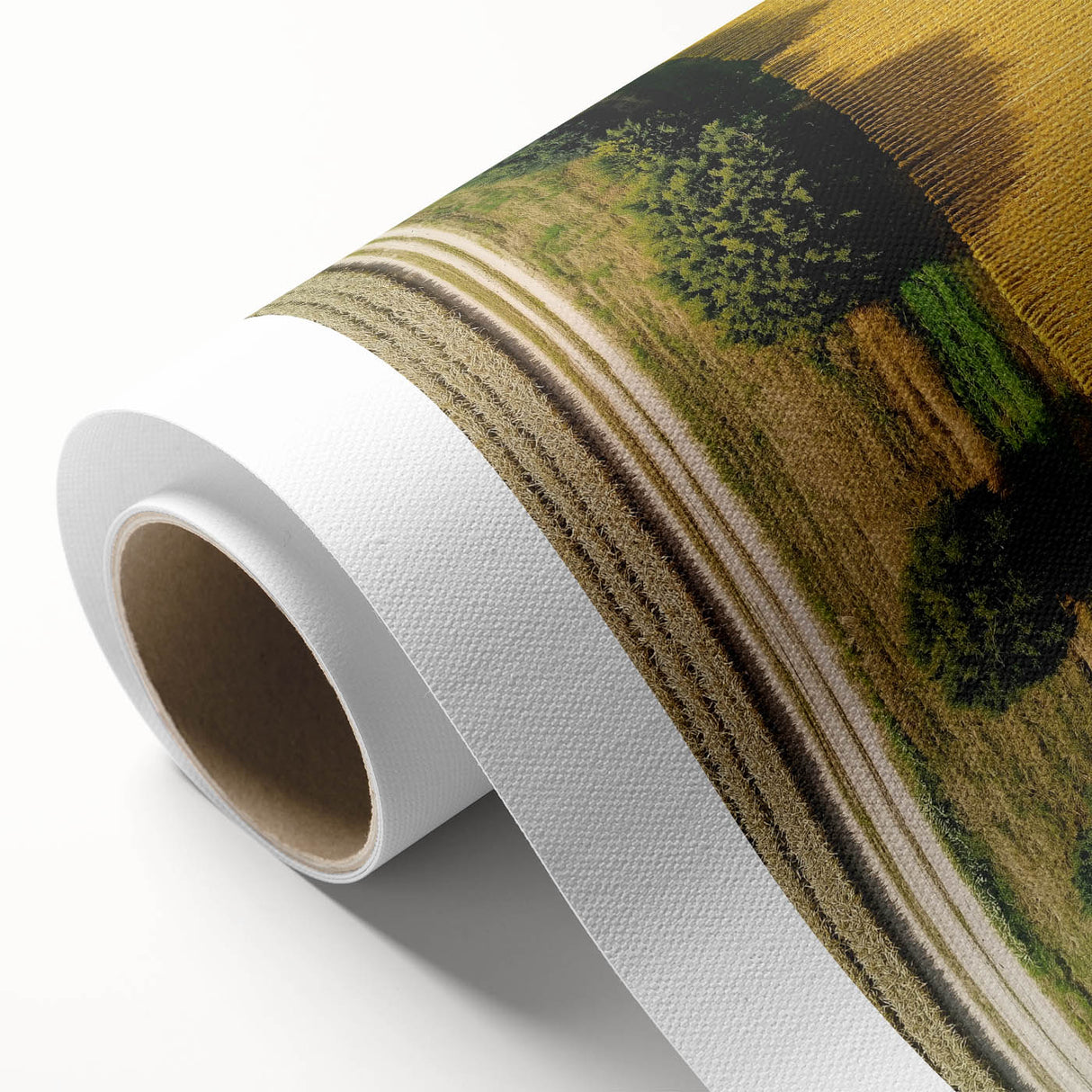 Rolled canvas artwork depicting a serene countryside landscape, showcasing lush green fields and rolling hills, perfect for home decor or office enhancement.