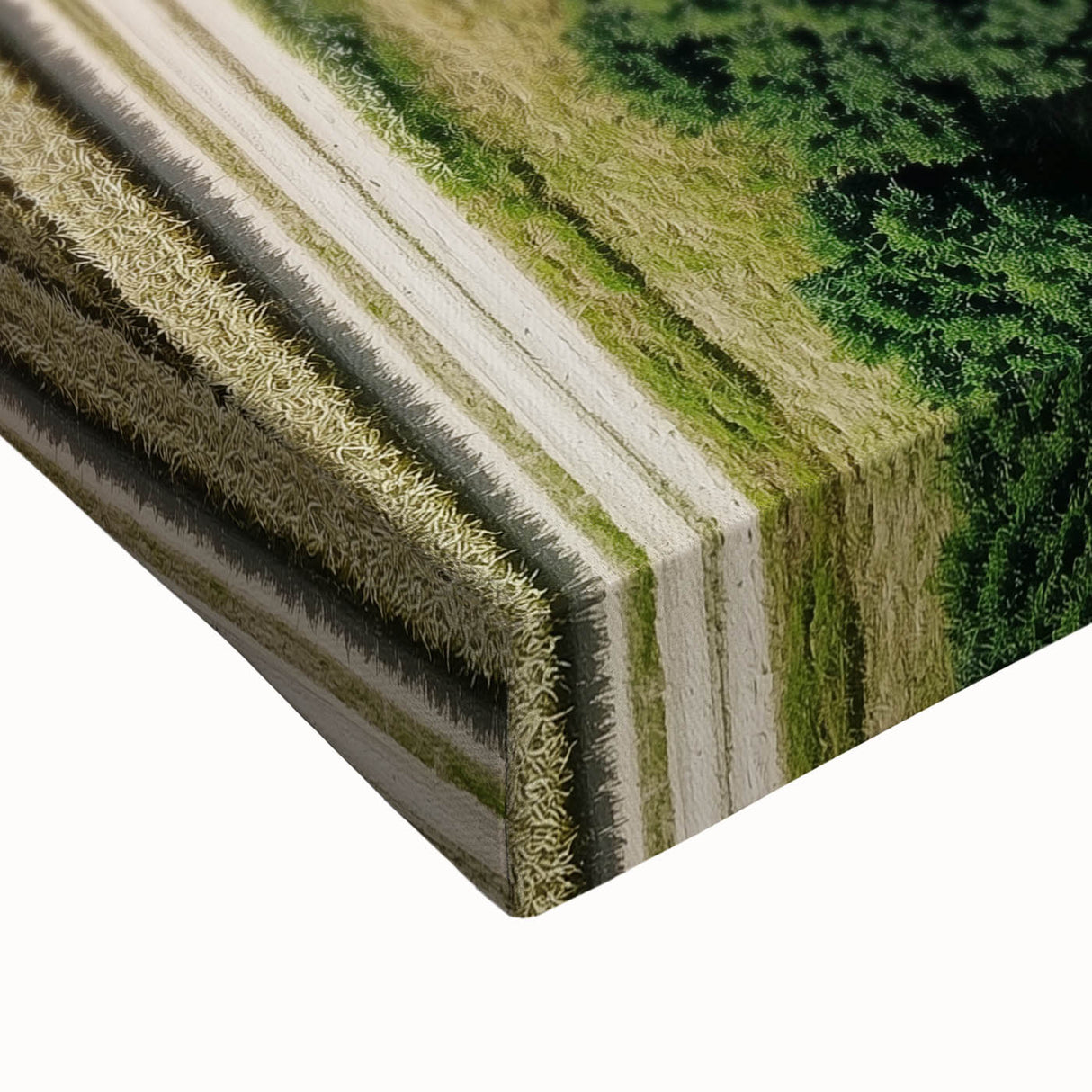 Close-up of a vibrant stretched canvas artwork depicting a serene countryside landscape, showcasing lush green fields, a clear blue sky, and rolling hills, perfect for home decor.