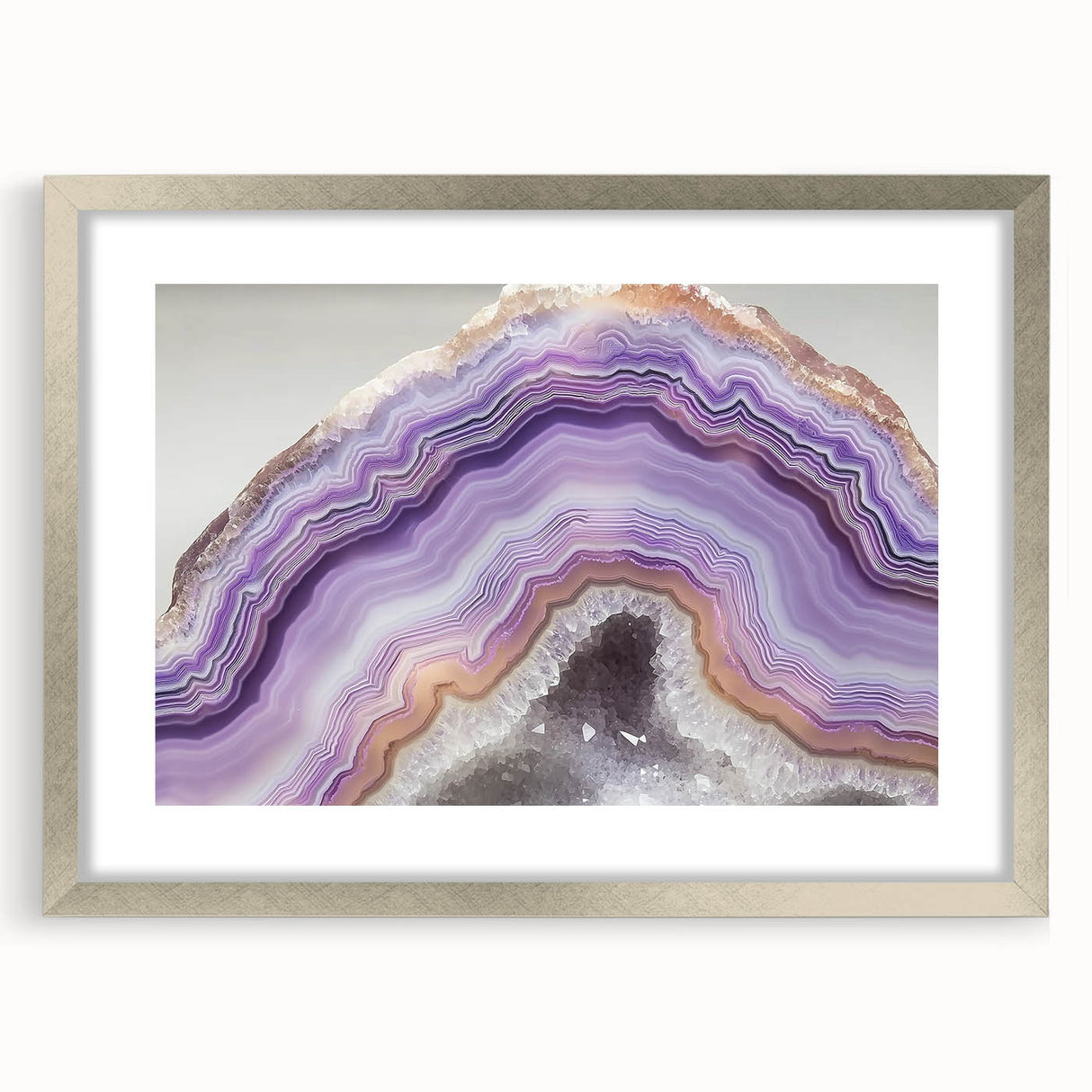 Textured abstract art print featuring close-up elements of nature in muted green and brown, framed in silver.