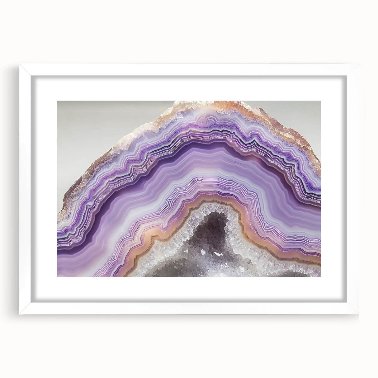 Abstract art print featuring close-up nature elements in muted green and brown tones, framed with a white mat.