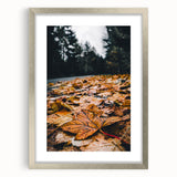 Textured abstract art print with orange and brown hues on a silver-framed canvas, ideal for bedroom wall decor.