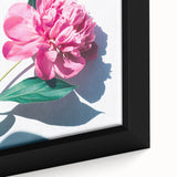 Close-up of a black framed canvas featuring a textured, colorful abstract design, ideal for large living room walls.