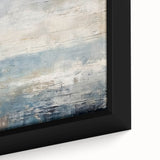 Close-up of a framed canvas wall art piece featuring vibrant abstract strokes in shades of blue, orange, and gold, perfect for modern home decor.