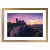 Elegant gold-framed landscape artwork showcasing a picturesque castle scene, complete with a white mat for added depth, perfect for enhancing home decor.