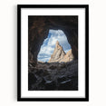 Framed landscape artwork depicting a serene cave scene, showcasing earthy tones and intricate details, with a black mat and sleek frame for an elegant presentation. Perfect for enhancing home decor or as a unique gift.