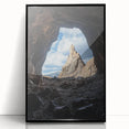 Framed acrylic artwork showcasing a stunning landscape with caves, featuring a sleek black frame and vibrant colors, ideal for home or office decor.