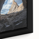 Close-up of a framed canvas artwork depicting a vibrant landscape with intricate cave formations, showcasing rich colors and detailed textures, ideal for home decor.