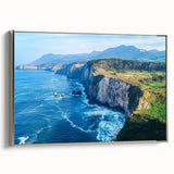 Framed canvas artwork depicting a stunning cliff landscape with vibrant colors and intricate details, featuring a sleek silver frame for an elegant presentation.