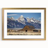 Elegant barn frame showcasing a landscape design with a gold mat, perfect for enhancing home decor. The frame features intricate detailing and a polished finish, ideal for displaying cherished artwork or photographs.